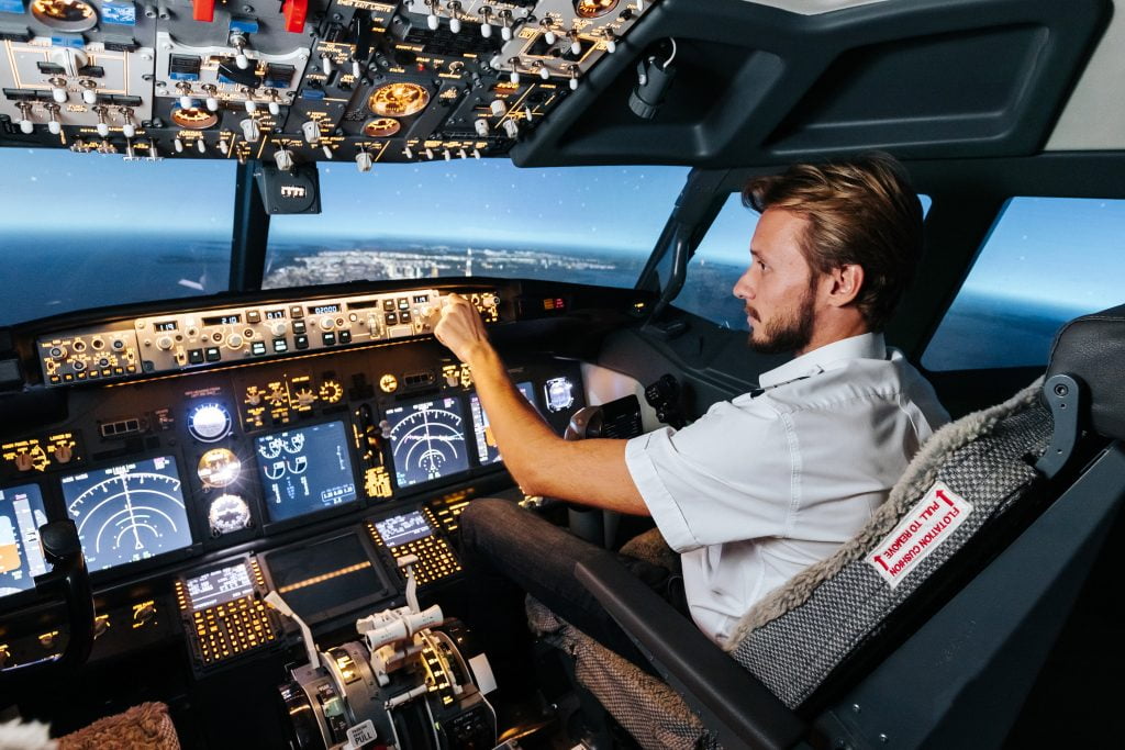 A First officer Is Flying Controlling The AutoPilot.