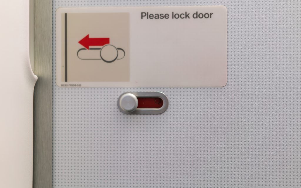 Airplane lavatory lock door