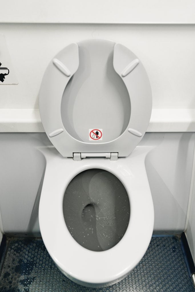 What happens when you flush an aircraft toilet